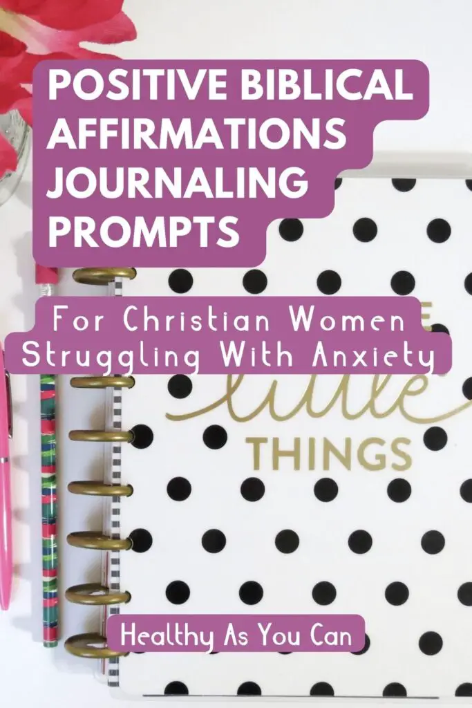 purple and white lettering positive Christian affirmations black and white dotted journal on desk 