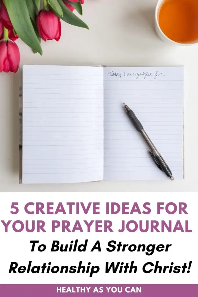 purple and black lettering prayer journal ideas white journal on white desk with pink flowers