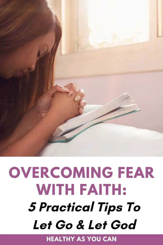 woman praying over a journal overcoming fear with faith in purple letters
